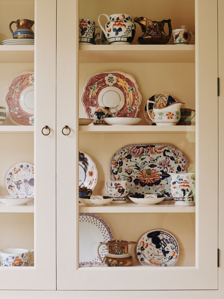 tamsin filled the glass cabinet with colorful china and lusterware. 25