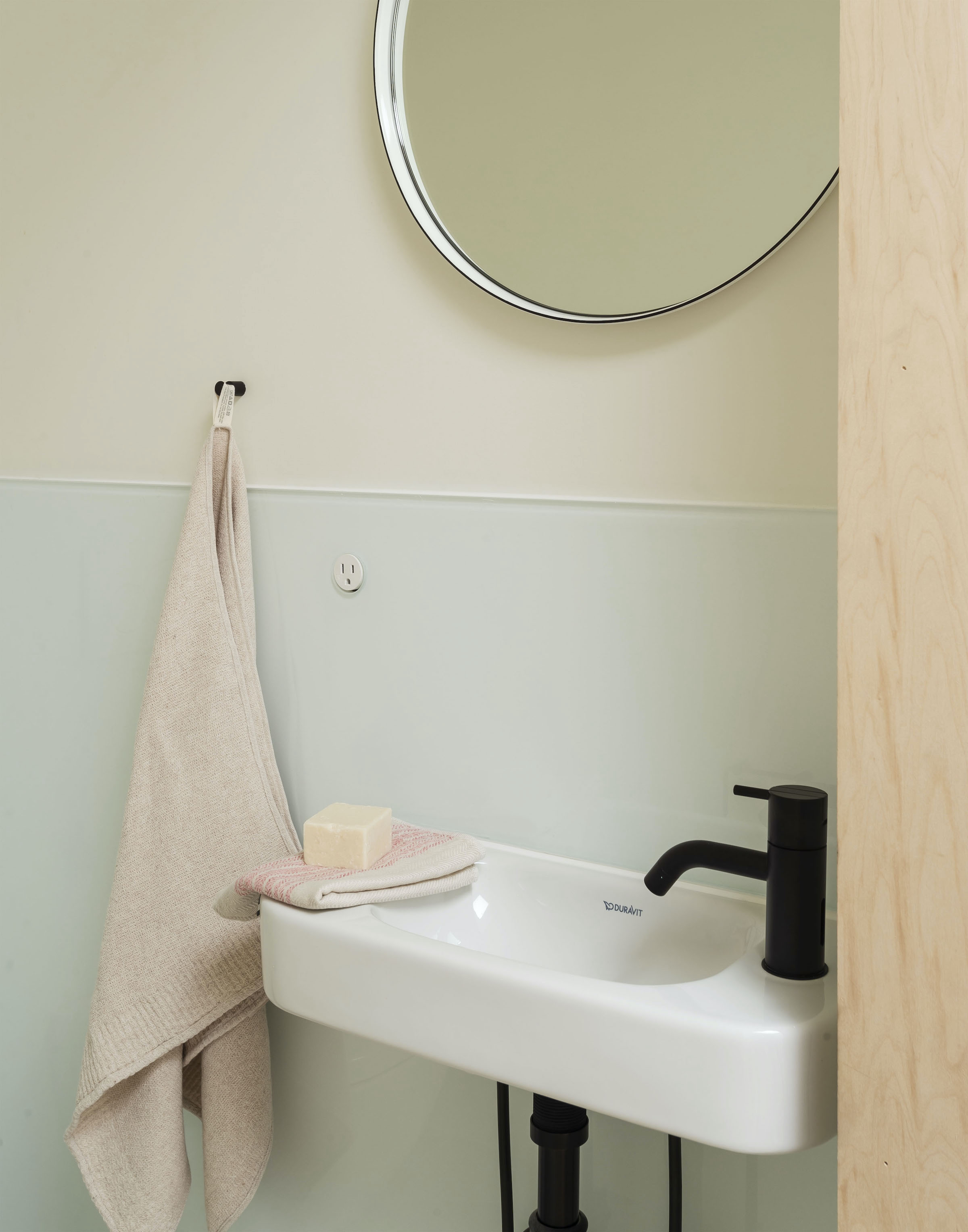 Tiny powder room in Bed Stuy passive house. architects Ruth Mandl and Bobby Johnston of CO Adaptive. Matthew Williams for Remodelista photo.