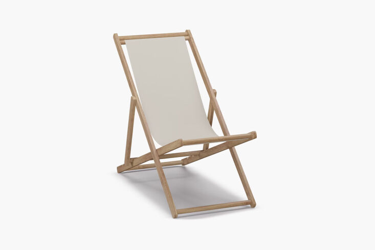The folding chair is a vintage Japanese wooden deck chair. For something similar, the Cabana Chair in off-white canvas is \$\1\29 at The Inside from Havenly.