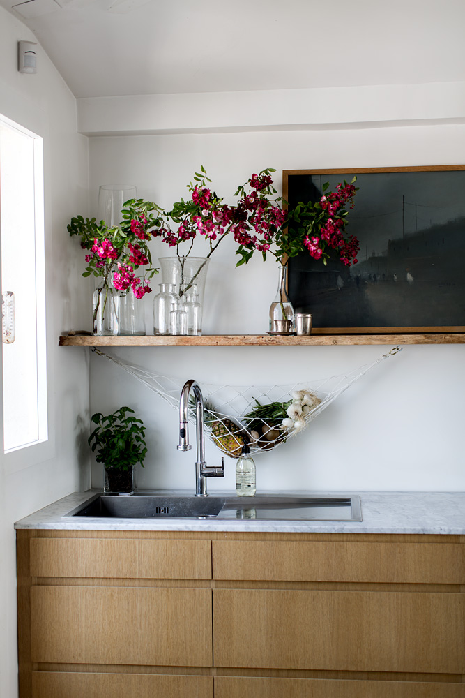 beneath the shelf, antoine hung a hand tied rope hammock for storing fruits and 20