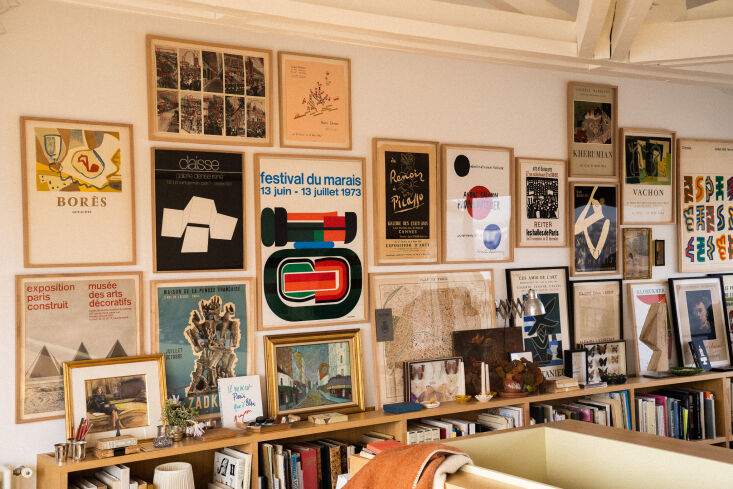 opposite the kitchen office hybrid, antoine has low slung bookshelves and walls 23