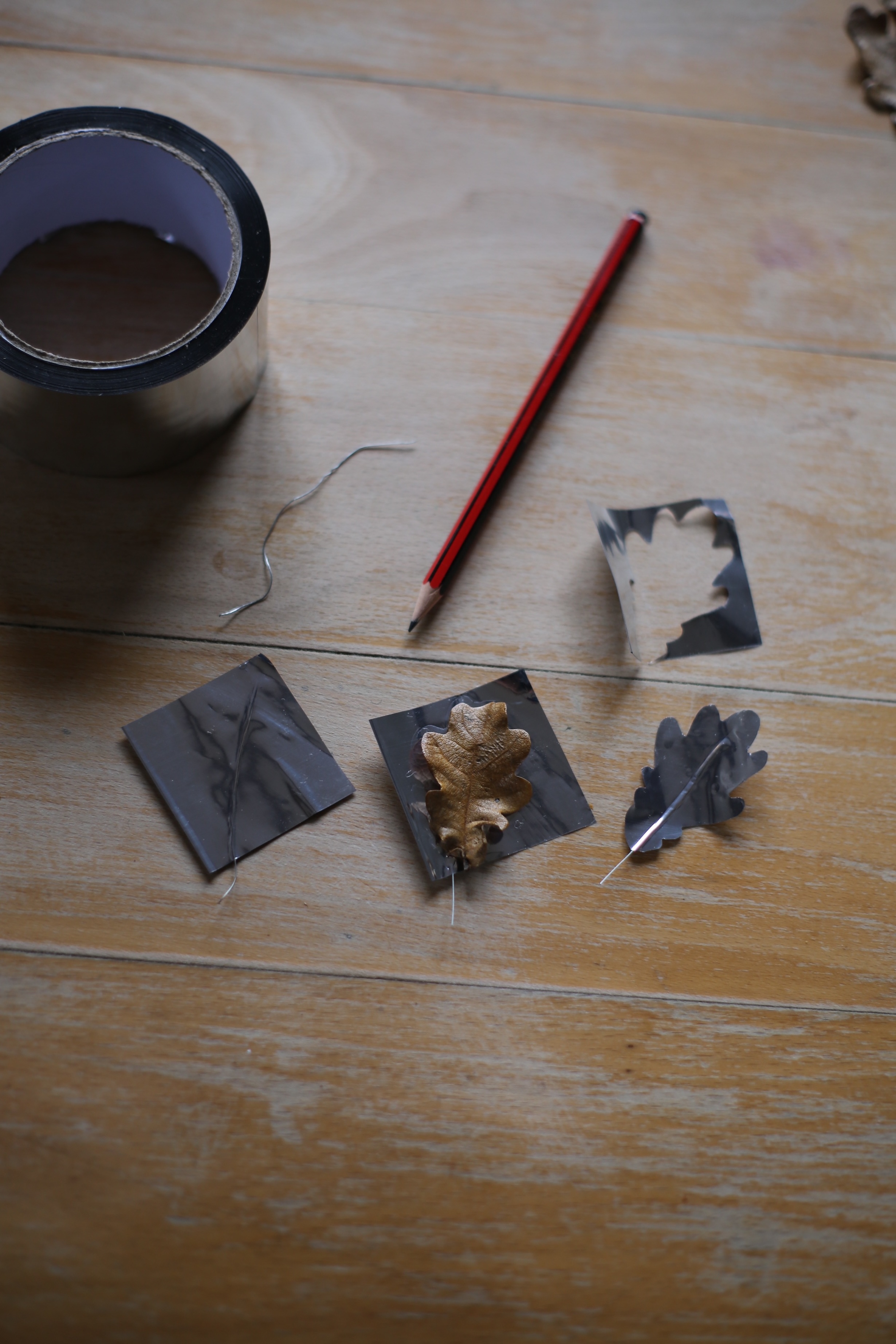 The leaves are traced on squares of aluminum foil tape that\2\17;s folded over to give it more weight.