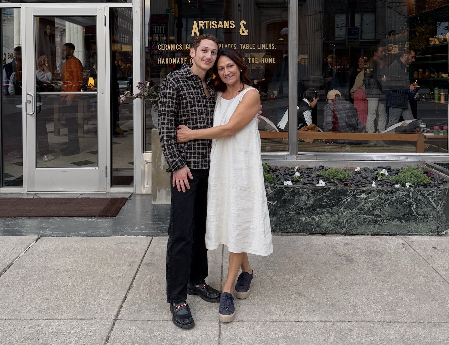 brooks william and lisa barger in front of their new shop artisans and in colum 9
