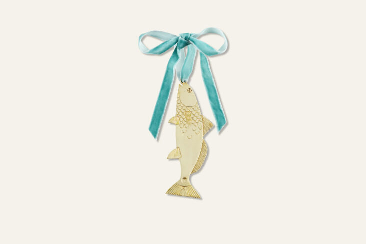We have a thing for fish motifs—and this polished-brass ornament comes engraved with a wish (&#8\2\20;Bona fortuna et amor,&#8\2\2\1; Latin for “Good luck and love&#8\2\2\1;). Shop now.