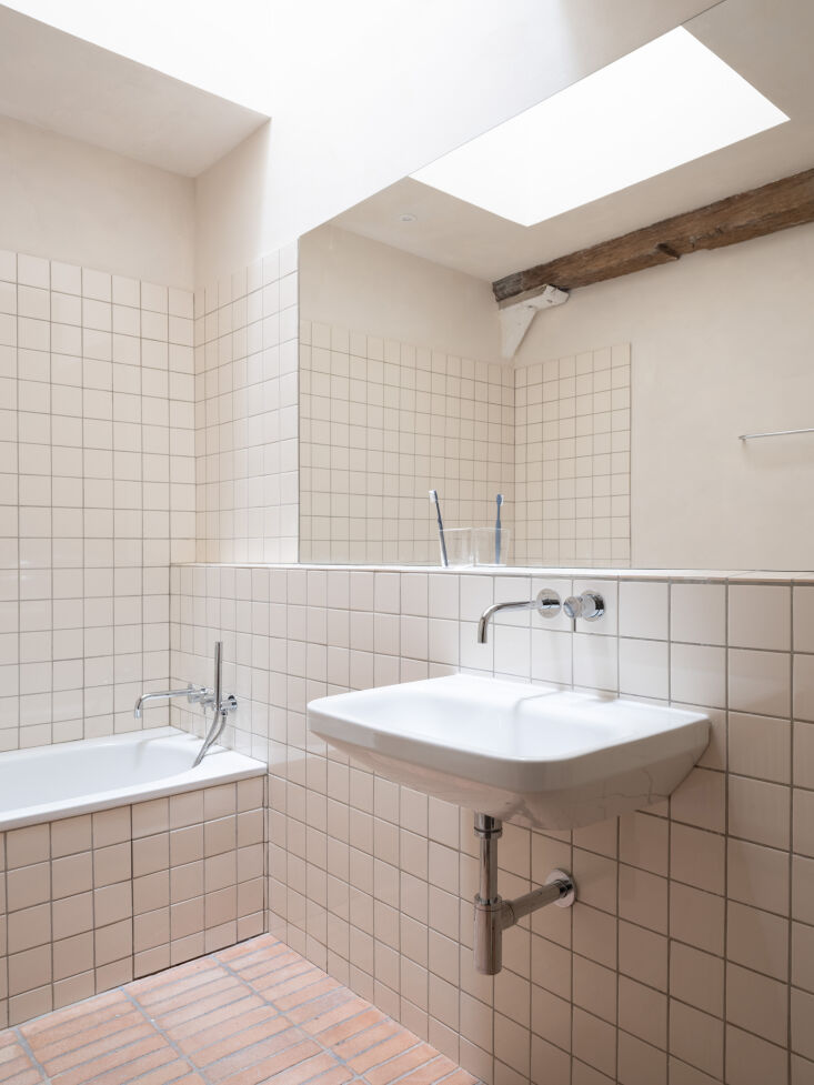 square tiles in the bathroom are from primus vitoria in portugal. the floor til 29