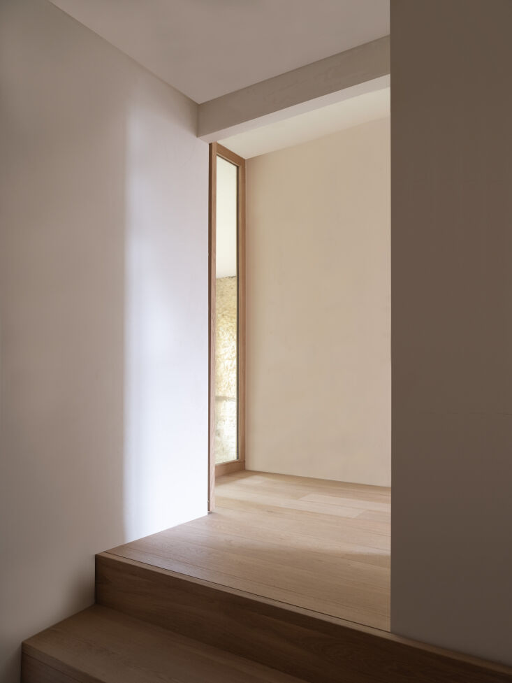 the second story is defined by oak flooring and white walls and tunnels—or sk 30