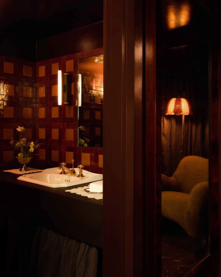 a bathroom and lounge area. 27