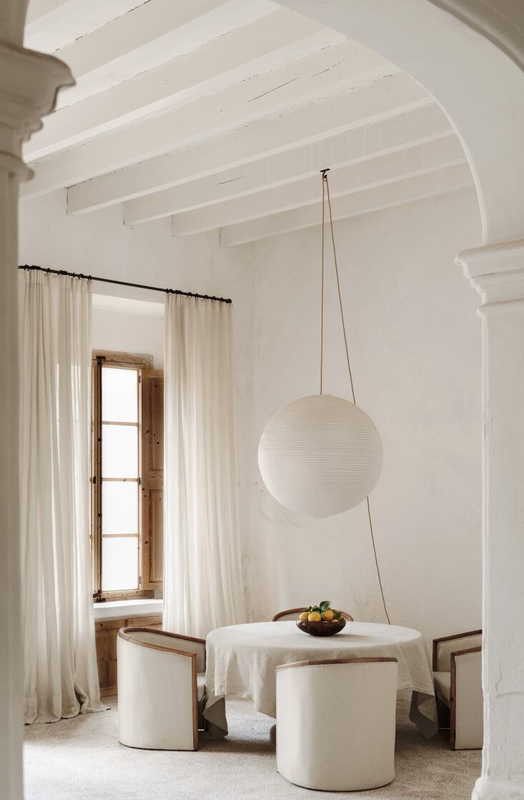 the entry opens to a small indoor dining area. the couple preserved the layout  19