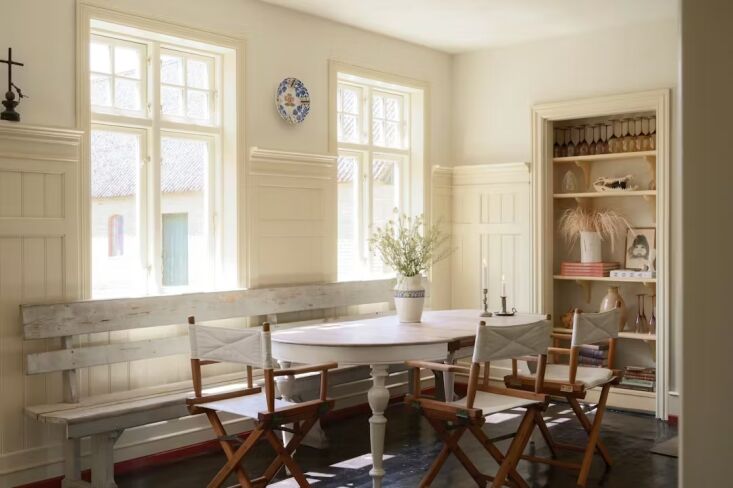 the dining room features a set of fritz hansen directors chairs. 24