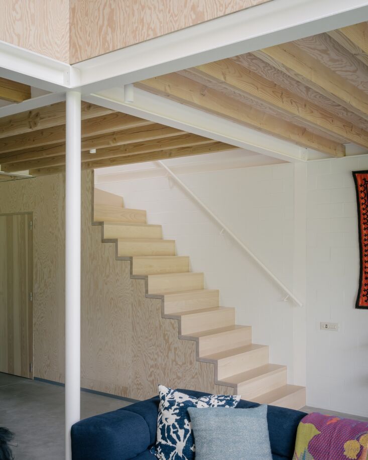 a sculptural open stair leads to two bedrooms, an office/child\2\17;s ro 23