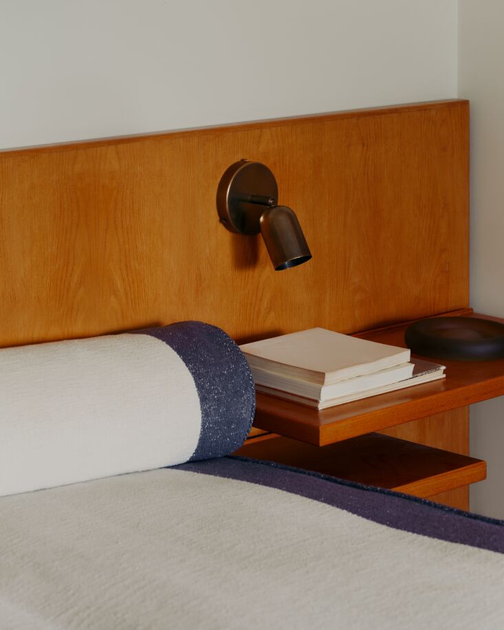 the spot surface mount in patina brass in another bedroom. 26