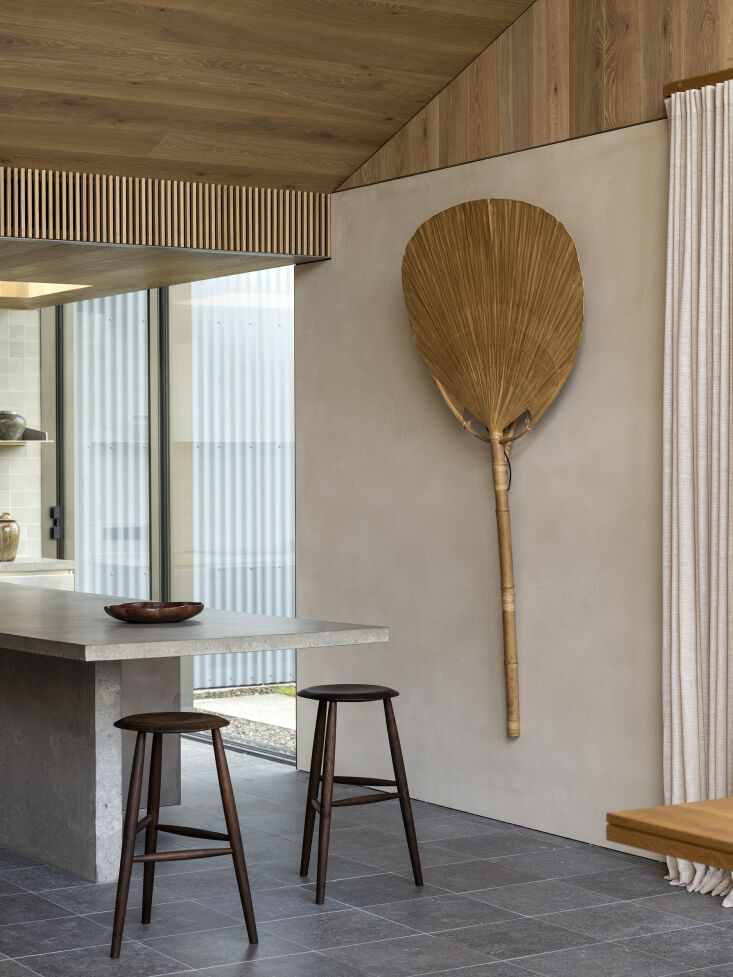 the barstools are sawkille tall stools in american black walnut next to which i 26
