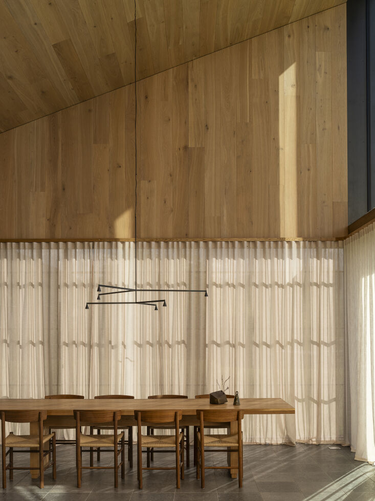 the chairs are børge mogensen j39 mogensen chairs in walnut. the chandelier is 28