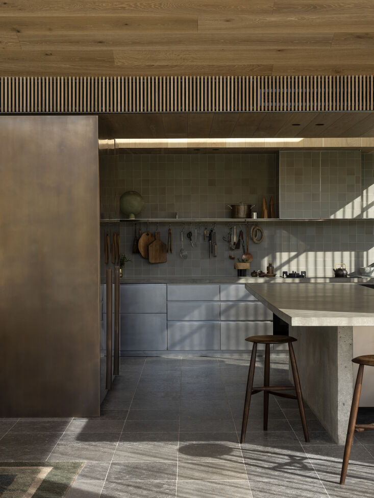 the kitchen cabinets are made of orbital brushed stainless steel sheeting. the  23
