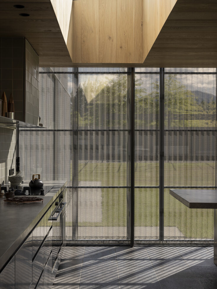 perforated corrugated panels were designed to filter light while acting as both 25