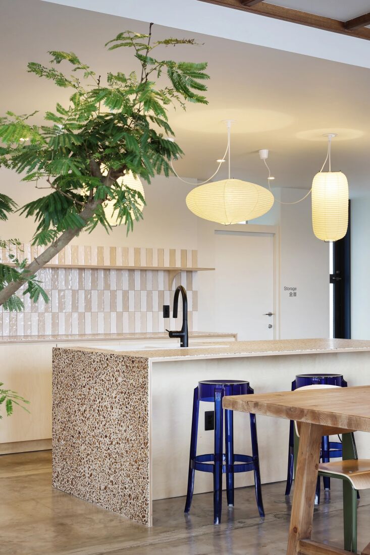 the kitchen island at evo hotel hakuba in nagano, japan, is finished in timber 17