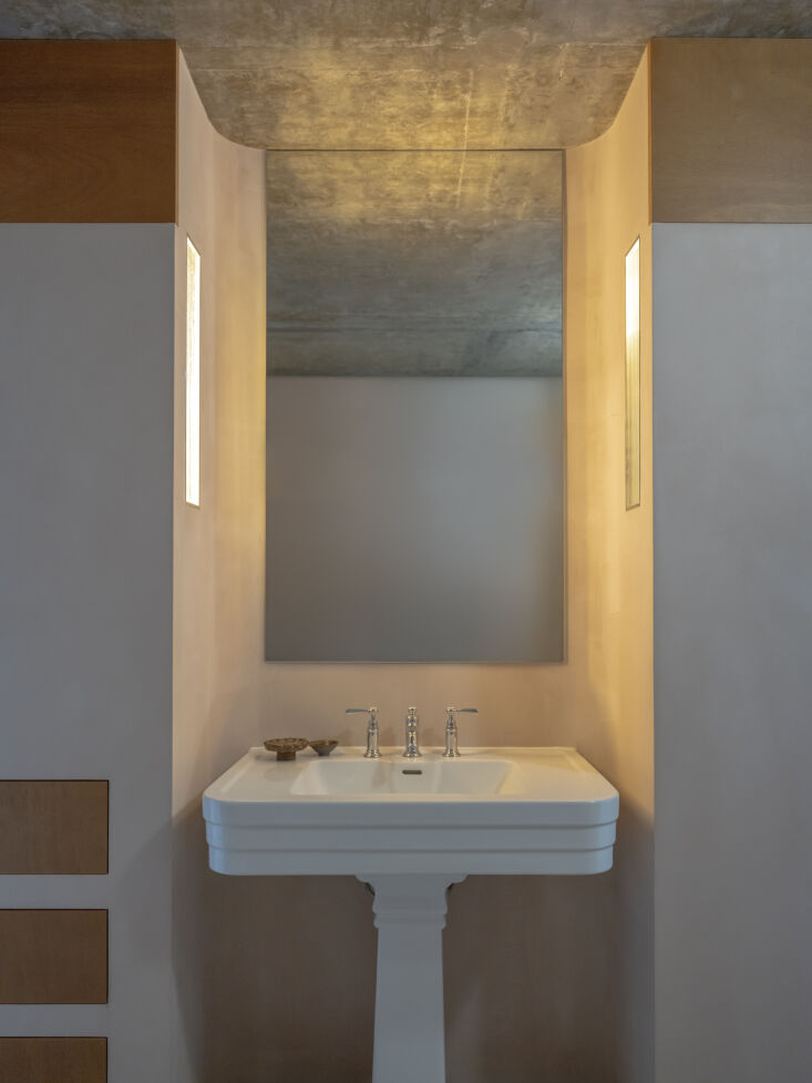 the bathroom is designed as a through space with dual access. the devon & d 27