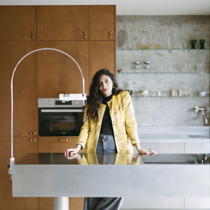 saba ghorbanalinejad stands in the oberkampf apartment kitchen. 31