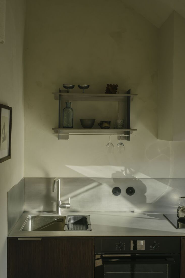 the kitchen and bathroom cabinetry is designed with oak veneered plywood fronts 30