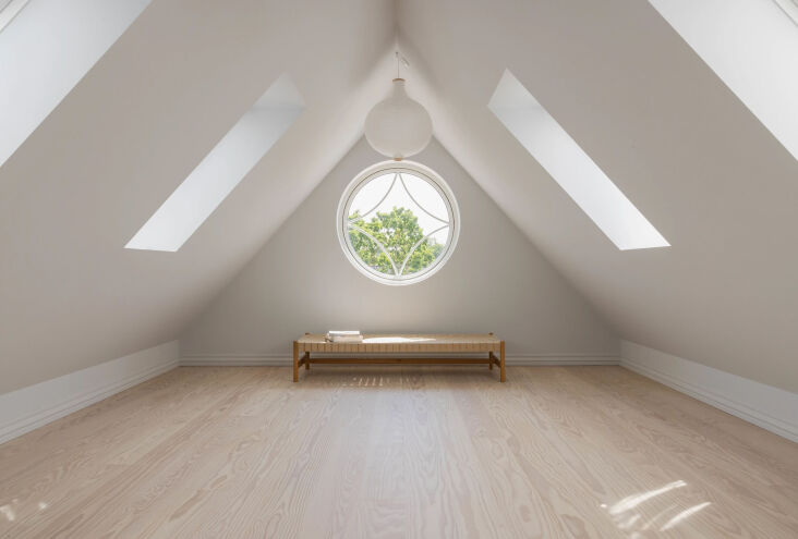the attic level, too, was fully renovated. the circular window was an original 26