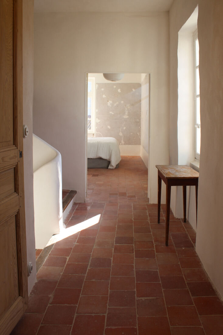 a look down the hallway between rooms on the second level. 26