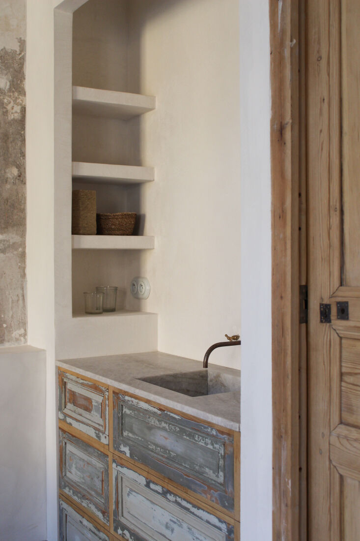 reclaimed shutters found in a storage room in the house and a quartzite counter 29