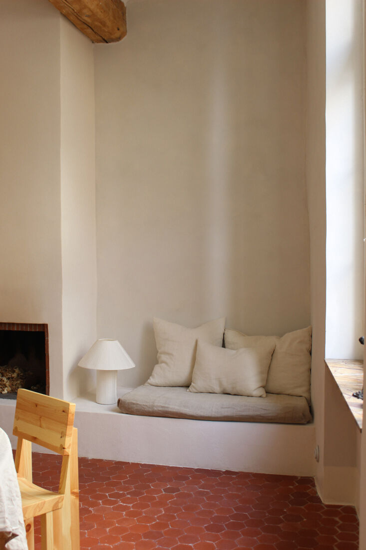 the team designed built in seating with a linen pad beside the chimney. they so 19