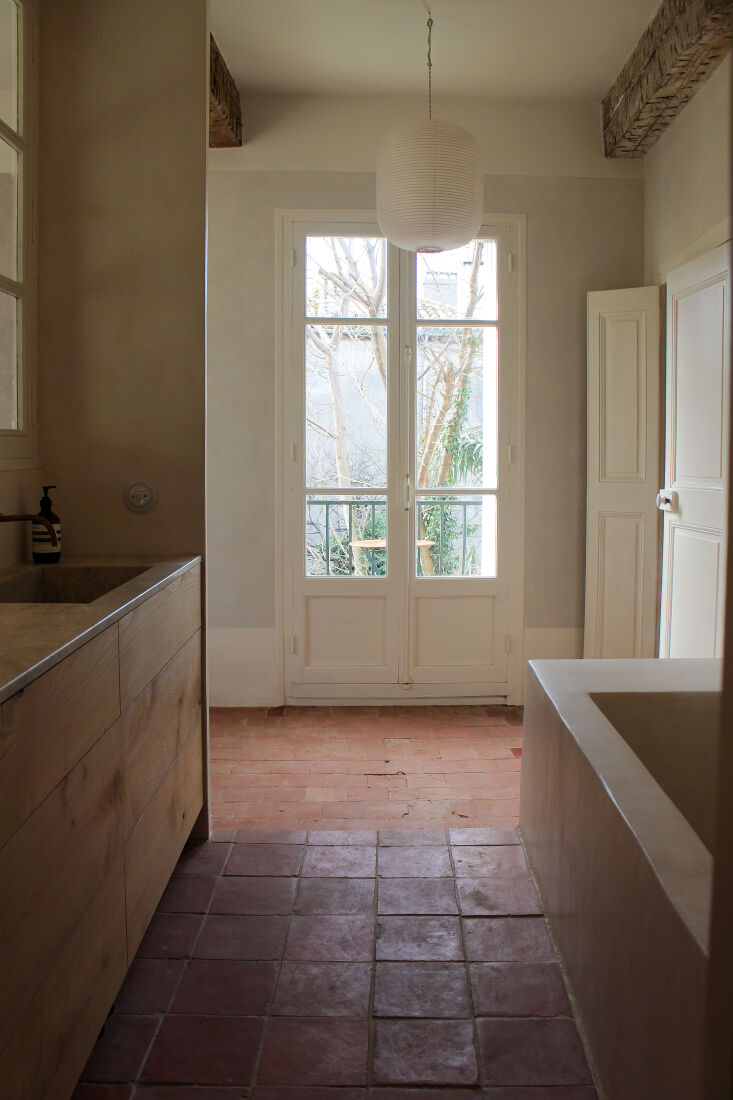 masgård and doux août retained the original terracotta tiles. they added a ri 24