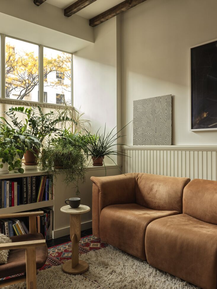 the office is appointed with a mix of new and previously owned furniture. a vin 19
