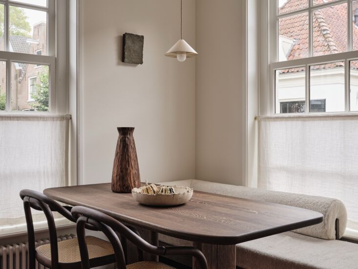 the pendant light above the dining table is the alba top pendant from contain i 22