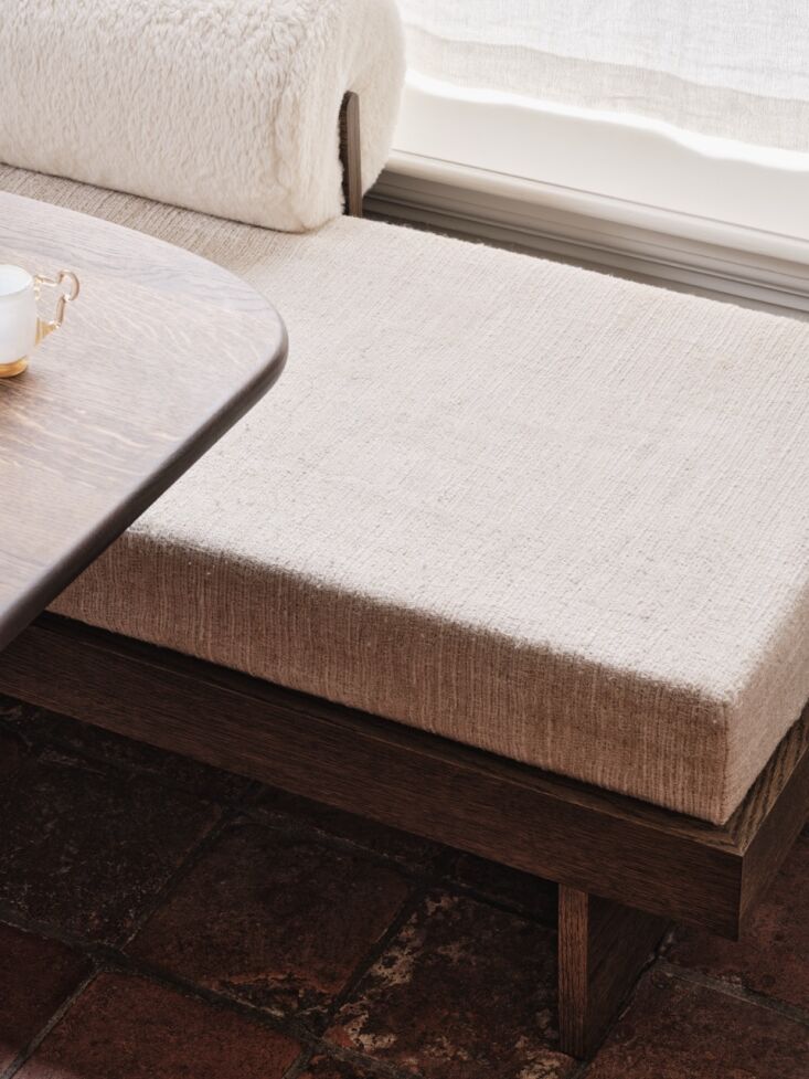 the built in sofa is upholstered with milma yp\2003 virgin wool from designs of 23