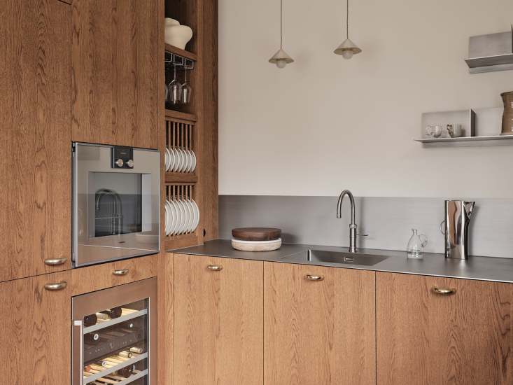 the custom cabinets are all done in oak with an ultra thin brushed stainless st 19