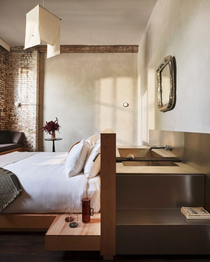 the fabric light is a soft counterpoint to the metal, wood, and brick that domi 19