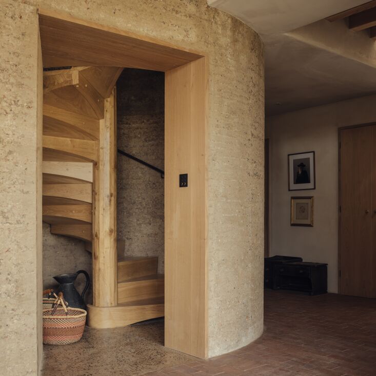 a rammed earth turret is designed with an oak staircase completed with the expe 30