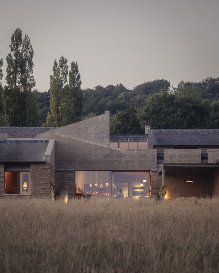 rammed earth is pared with oak, limestone, clay plaster, and copper with interi 32