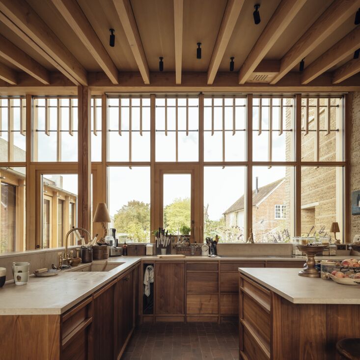 the kitchen was designed custom with walnut joinery by orwells furniture. the w 22