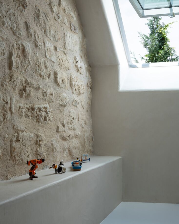 original stonework meet new built in plaster seating. 25