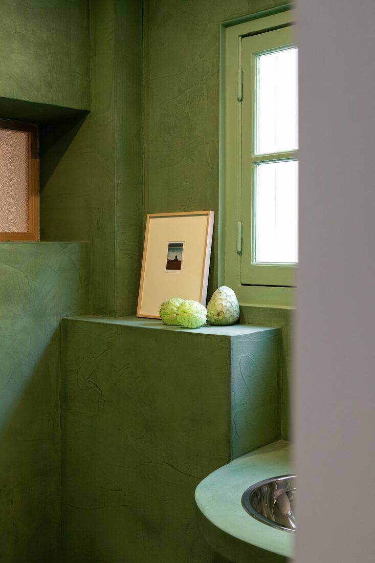 the console is also built of colored concrete and set with a simple stainless s 24