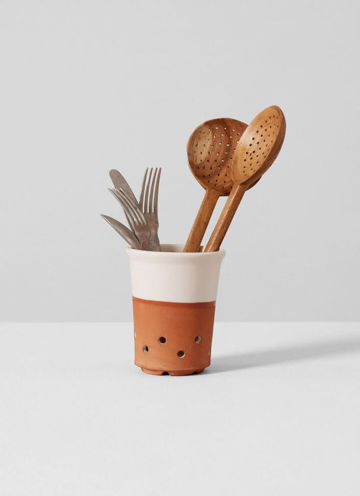 the willow pottery cutlery drainer, \$75, has a partially raw exterior and a fu 20