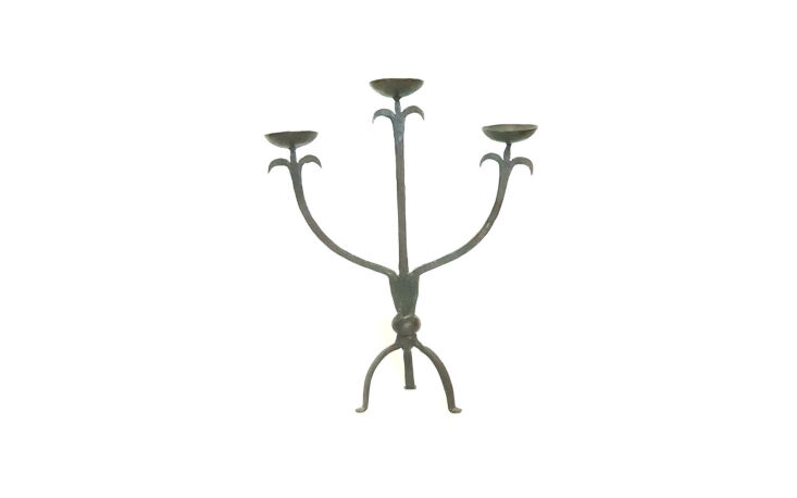 aha: the candle holder in question is a vintage wrought iron number, circa the 18