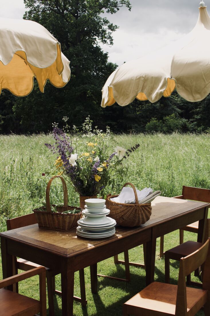 a creative stack of plates and baskets with napkins or snap peas. 19