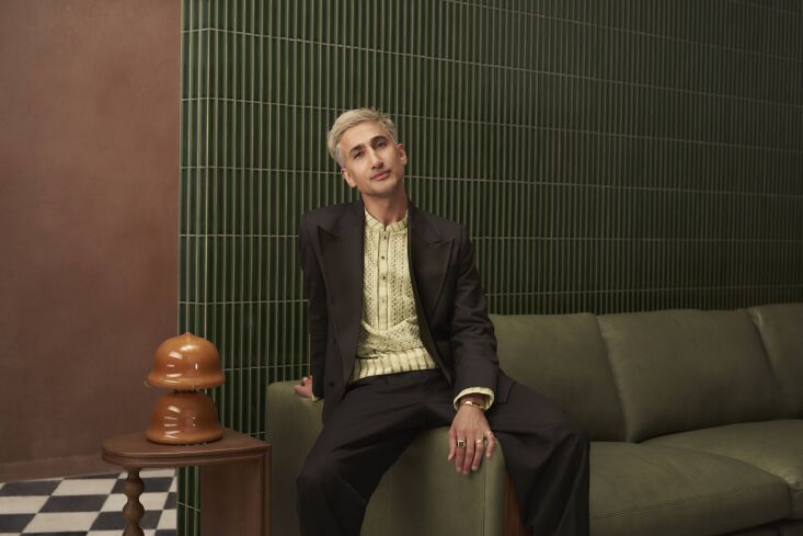 Tan (and a sofa and glass light of his own design).