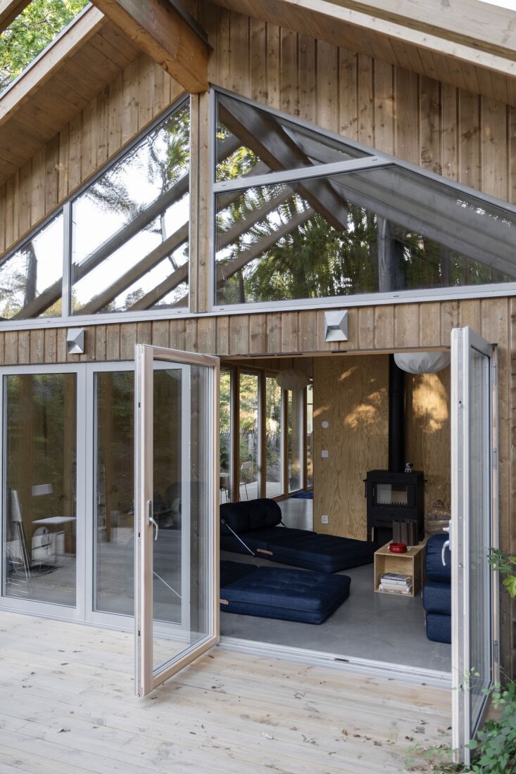 a glimpse into the living room surrounded by pine woods. elisabeth and dennis s 22
