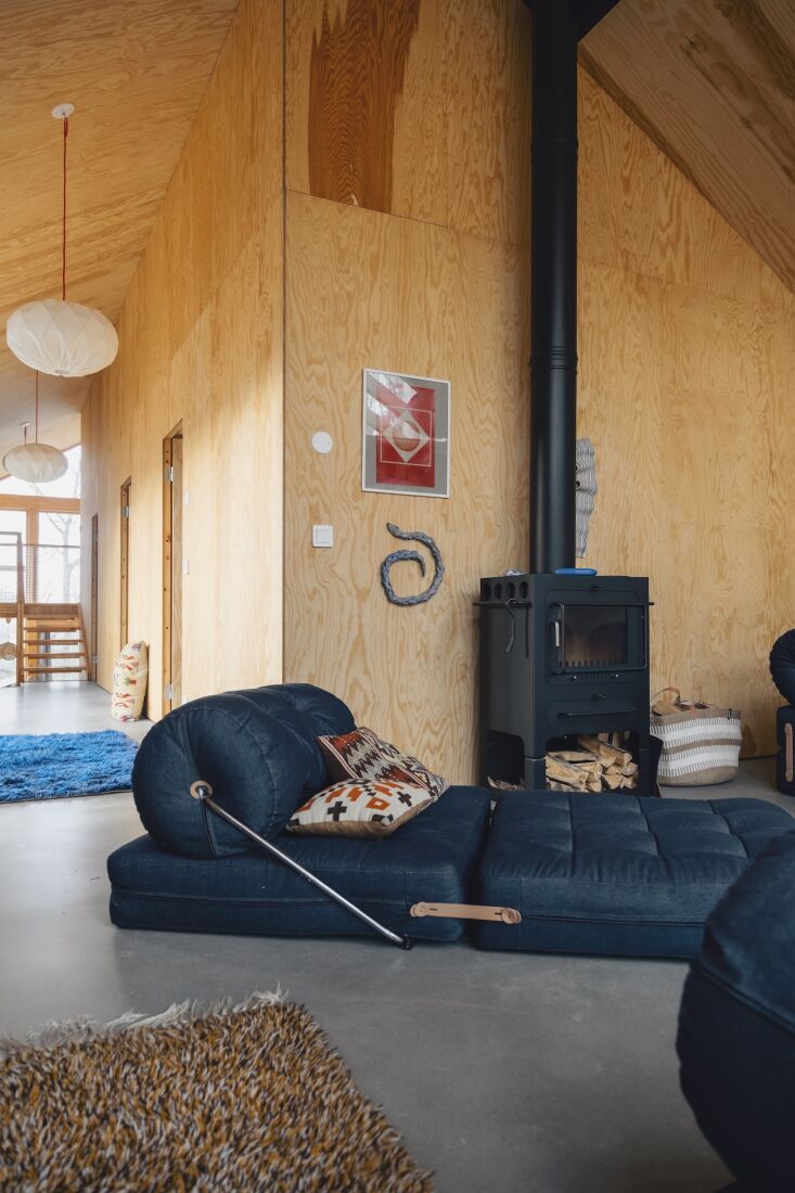 the sofas and chairs double as lounges and extra beds. the hall doors lead to t 24