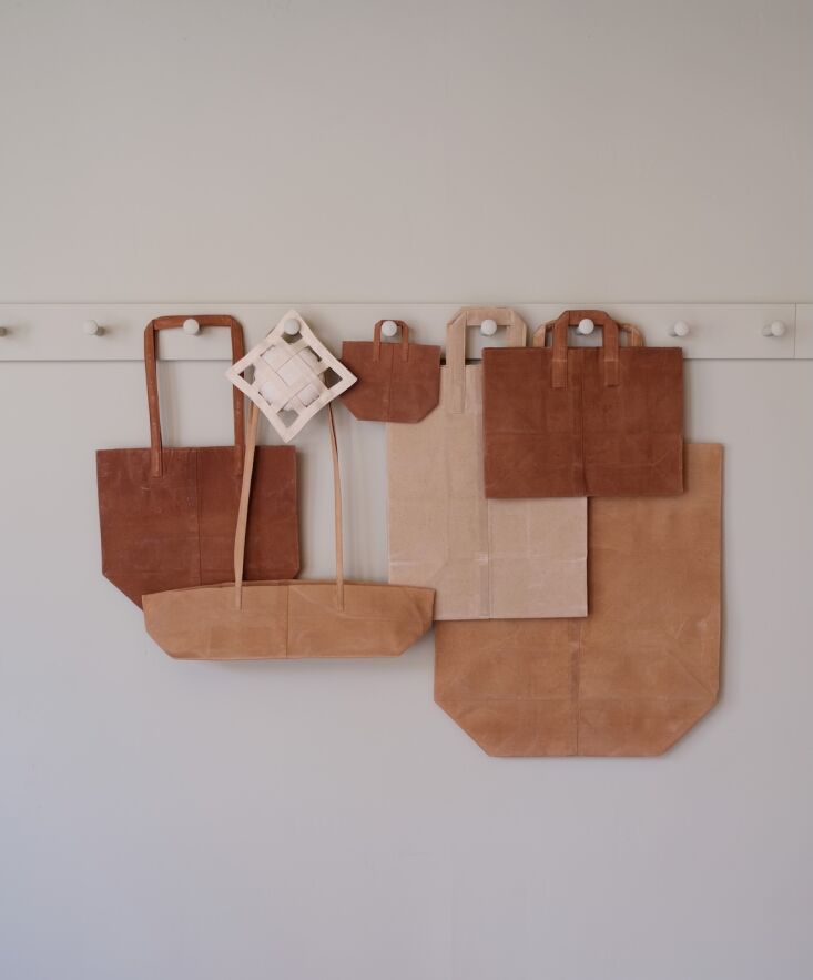 artist kazumi takigawa hand sews her paper bag inspired waxed canvas totes in h 22