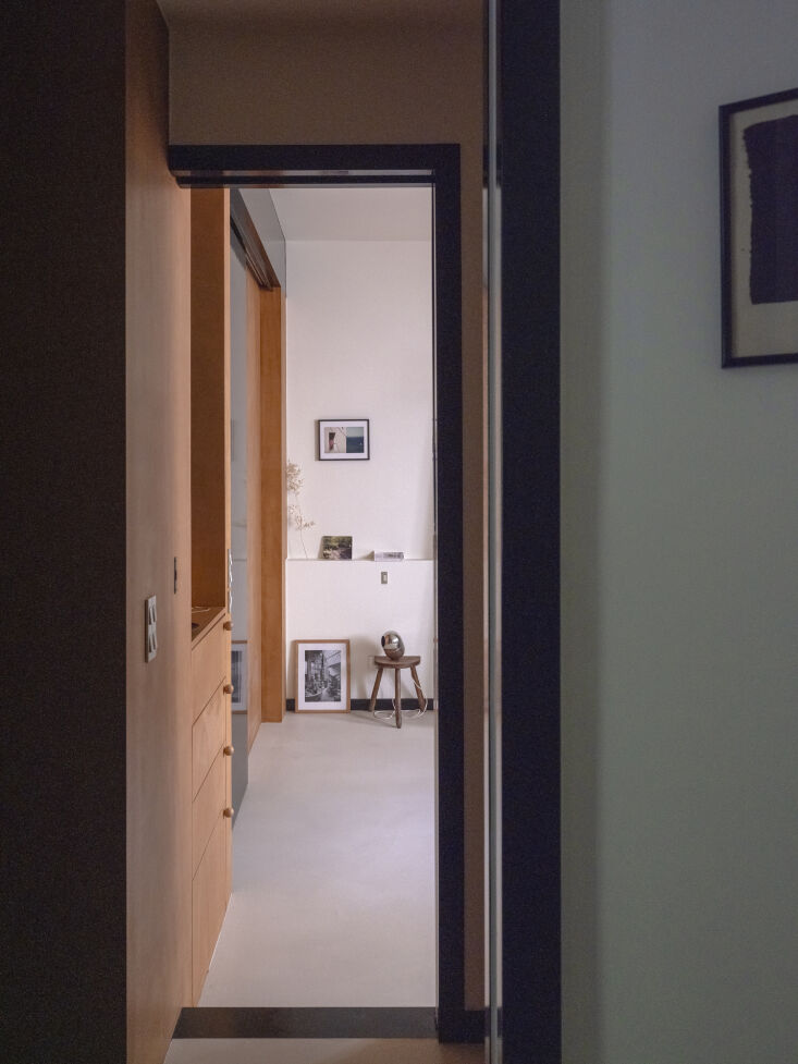 a view into the bedroom reveals the integrated okoumé wall storage and space s 26