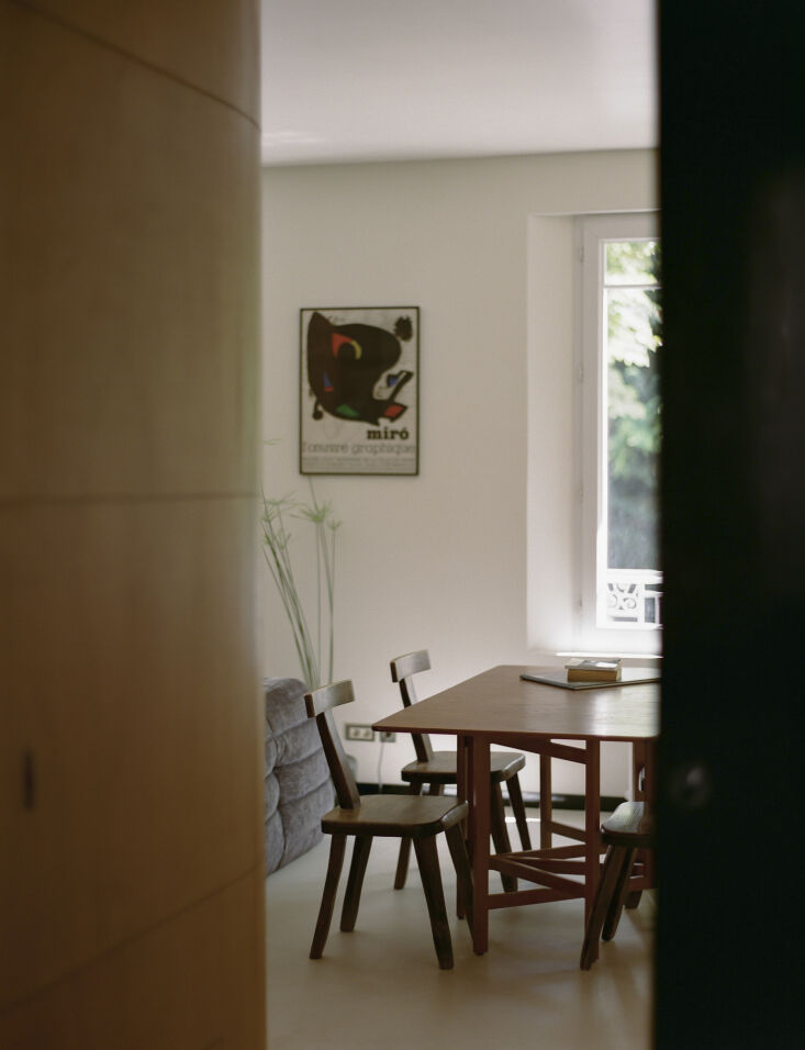 a detail of the \1960s brutalist t chairs and a framed joan miró lithograph be 25