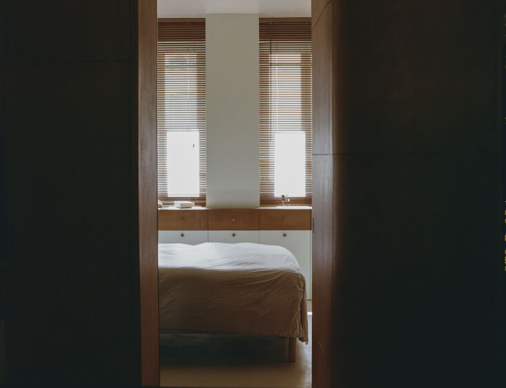 the bedroom was relocated to the quieter courtyard side. a glazed partition sep 32