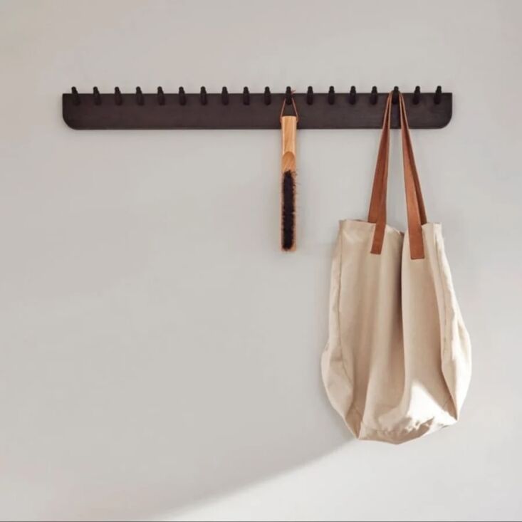 This dark—and Danish—take on the peg rail turns order into beauty. Shop now.