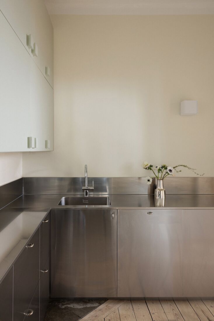 the office kitchen is a combination of old and new: aska paired existing wooden 22